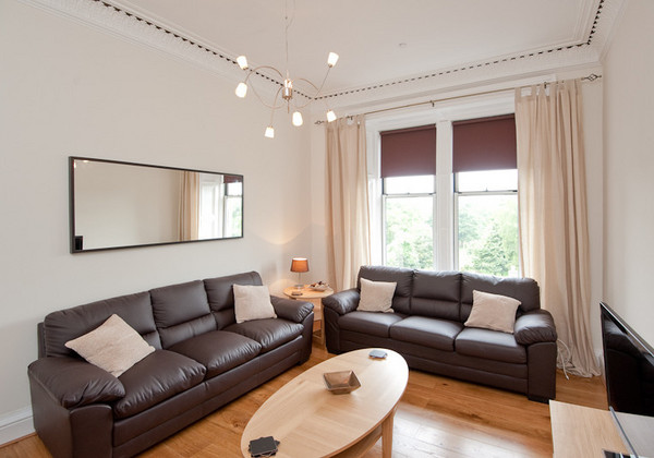 The spacious living room - This living room, the first of two in this fantastic apartment, features three full size leather sofas, one of which becomes a sofa bed if required. The spacious living room - This living room, the first of two in this fantastic apartment, features three full size leather sofas, one of which becomes a sofa bed if required.