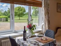 Dining room countryside views from a Norfolk holiday home