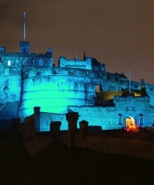 CastleEsplanade_02 - View of Edinburgh castle lit up in blue light at night