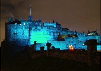 CastleEsplanade_02 - View of Edinburgh castle lit up in blue light at night