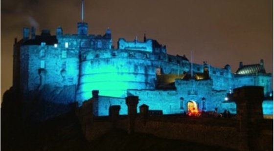 CastleEsplanade_02 - View of Edinburgh castle lit up in blue light at night