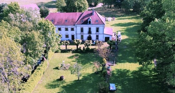 Family holiday gite with pool, Dordogne - Aerial view of the front of Moulin du Martinet. Tree lined parking and front of property with private garden (© Voila Villas France)