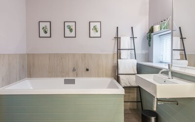 Bathroom 1 - The lodge bathroom with a beautiful bath and matching sink