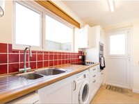 The kitchen with red tiles of The Crest, Norfolk