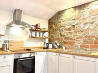 Fully stocked kitchenette.