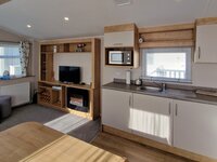 Lounge, with TV and Fireplace, Kitchen and Dining Area