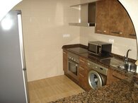 Brown Kitchen oven and washing machine cache_75692083