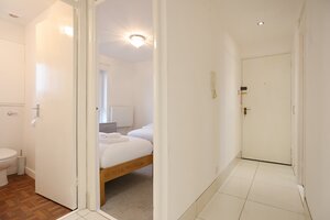 1V7A9884 - View of hallway looking into twin bedroom and bathroom