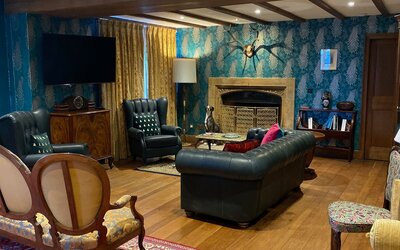 Entrance Lounge  in Luxury Holiday Let in Tay Valley - Spacious wooden floored room with ample comfy seating and wooden beams