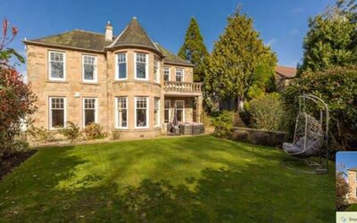 Stunning, Family-friendly Property - A stunning view of the home’s beautiful stone exterior surrounded by lush greenery