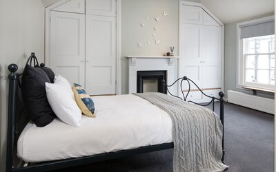 Spacious Bedroom for University Graduates - Elegant bedroom featuring comfortable, modern elements and ample natural light Spacious Bedroom for University Graduates - Elegant bedroom featuring comfortable, modern elements and ample natural light