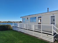 Outside side view of Boston Lodge with veranda