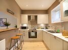 Kitchen and Breakfast Bar - Beautiful kitchen with breakfast bar and stools in Edinburgh holiday accommodation.