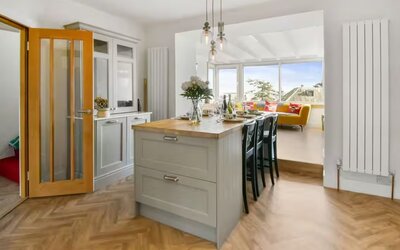 Open Plan Living & Dining Room with Stunning Sea Views - Stylish dining area with a central island table, seamlessly connected to the living room for a sociable space