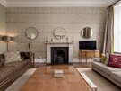 Modern Lounge in a Private Residential Tenancy - Chic, state-of-the-art living room with stylish earthy décor, blending modern luxury with natural warmth