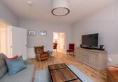 Cosy Lounge with Grey, Brown and Red Colour Touches