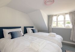 Twin bedroom at SeaPink Cottage