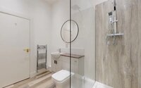 Shower Room - Stylish bathroom featuring a walk-in shower