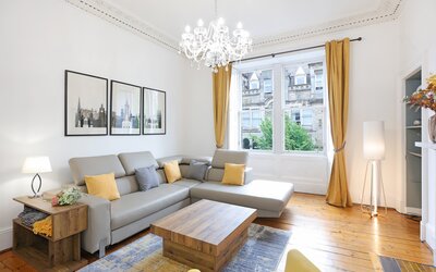 The Forrest Road Residence - living room - Living room at The Forrest Road Residence, with traditional wooden flooring and ornate cornicing.