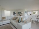 Clova Penthouse - living area - Open plan living area with comfortable sofas and kitchen