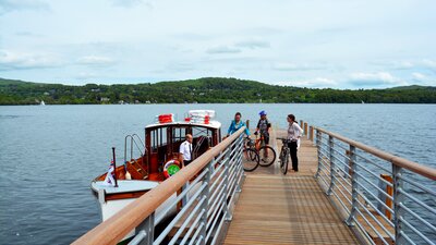 Boat on Windermere, The Lake District - Group of people with bikes boarding a boat to cruise on Lake Windermere (© Cumbria Tourism)