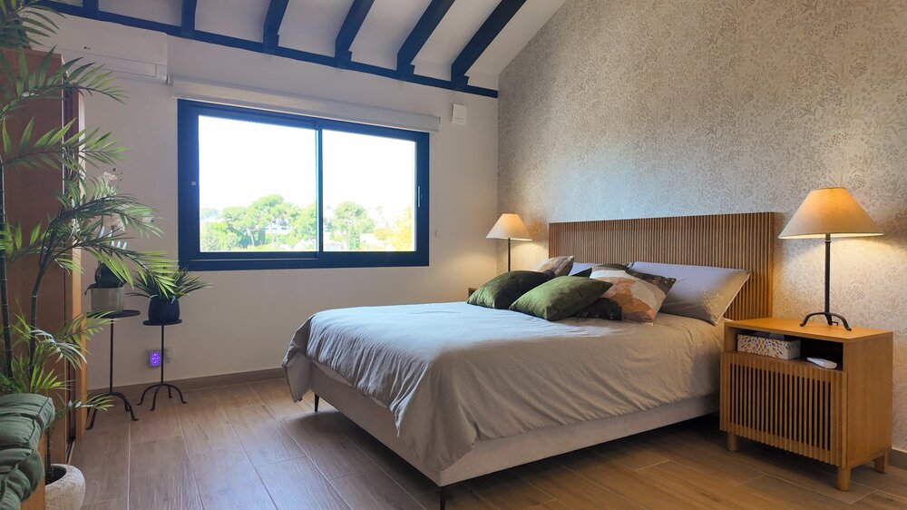 Cozy Bedroom with Vaulted Ceiling