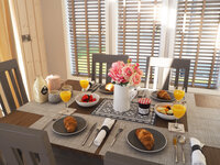 Dining table for 6 people in a Seal Bay resort holiday lodge