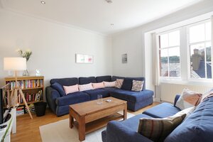 Law View - Comfy living room with views and featuring well stocked book case, in North Berwick holiday home.