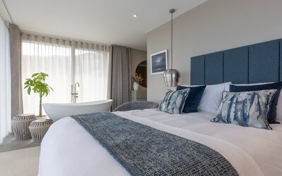 Bright Bedroom in a Vacation Rental - Super king-size bed and bath in a spacious while, grey, blue themed bedroom