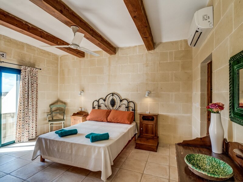 11. Main bedroom with ensuite and balcony and terrace overlooking pool area