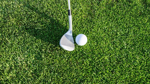 Golf at Gullane Golf Club - Golf ball and club on grass. (© Robert Ruggiero)