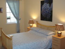 Double Bedroom - Spacious room with double windows facing the castle