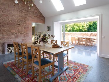Grieve's Cottage kitchen and terrace - Beautiful dining room. Abundance of natural light through terrace door and ceiling windows. Fits six dinners.