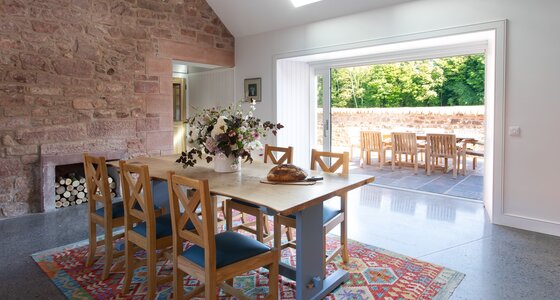 Grieve's Cottage kitchen and terrace - Beautiful dining room. Abundance of natural light through terrace door and ceiling windows. Fits six dinners.