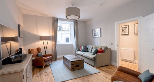 Stafford Street Apartment Lounge - Spacious lounge with grey and brown colour scheme in Edinburgh West End apartment.