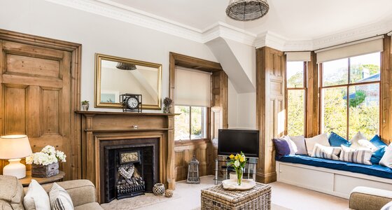 GILLIAN THE NEUK 23.04.26-17 - Bright and spacious living room at The Neuk Apartment in North Berwick with large bay windows, comfortable sofas and cosy seating area.