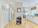 Gloucester Lane 14 - Contemporary, gleaming white kitchen within New Town Edinburgh holiday apartment.
