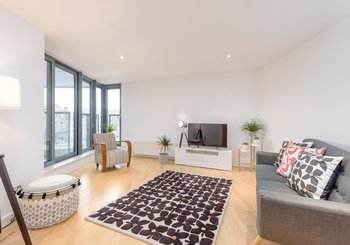 Sandport Way 1 - Spacious, contemporary living room featuring floor to ceiling windows in Edinburgh holiday apartment.
