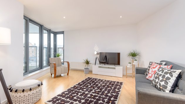 Sandport Way 1 - Spacious, contemporary living room featuring floor to ceiling windows in Edinburgh holiday apartment.