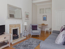 Living Room - The living room also has a small dining area in a delightful nook of the room. (© The Edinburgh Address)