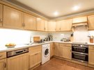 Kitchen - The kitchen is well equipped with top of the range appliances dishwasher, washing machine, fridge freezers, microwave, gas hob and electric oven (© The Edinburgh Address)