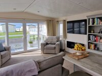Lounge with Large Patio Doors, TV and Fireplace