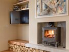 Living Area - Cosy log burning stove, with log feature fire place, and contemporary interiors in North Berwick holiday home.