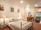 Master Bedroom with En-Suite in Scotland - The master bedroom is warm and relaxing, with a King-sized bed and en-suite (© The Edinburgh Address)