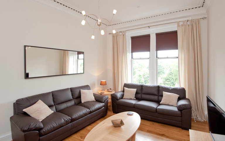 The spacious living room - This living room, the first of two in this fantastic apartment, features three full size leather sofas, one of which becomes a sofa bed if required. The spacious living room - This living room, the first of two in this fantastic apartment, features three full size leather sofas, one of which becomes a sofa bed if required.
