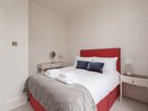 Coates Gardens 3 - Double bedroom with decorative cushions at Edinburgh holiday let