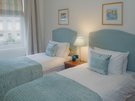 Lynedoch Place 5 - Twin bedroom with blue throws and cushions