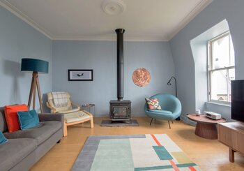 Living room at Rooftops - Cosy living room with wood burner and TV at North Berwick holiday let