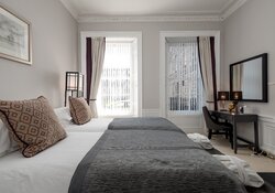 Elegant Primary Bedroom with Chandelier – Edinburgh