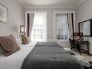Elegant Primary Bedroom with Chandelier – Edinburgh - Extra bedroom space designed for larger groups, making this apartment ideal for extended stays